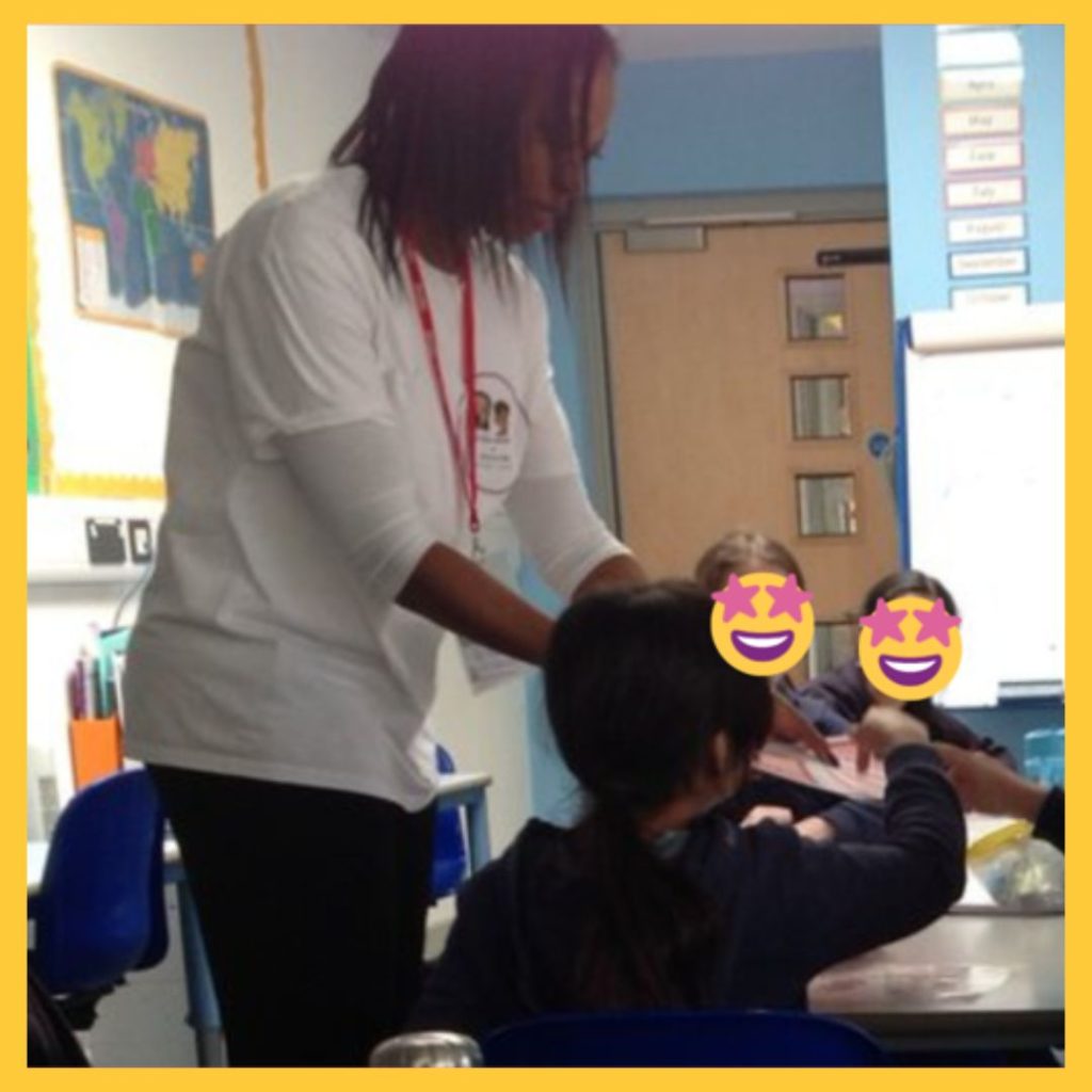 Author Beverly Clarke MBE interacting with children during a school visit, wearing an Ava and Chip book series t-shirt, promoting technology books for children in a classroom.